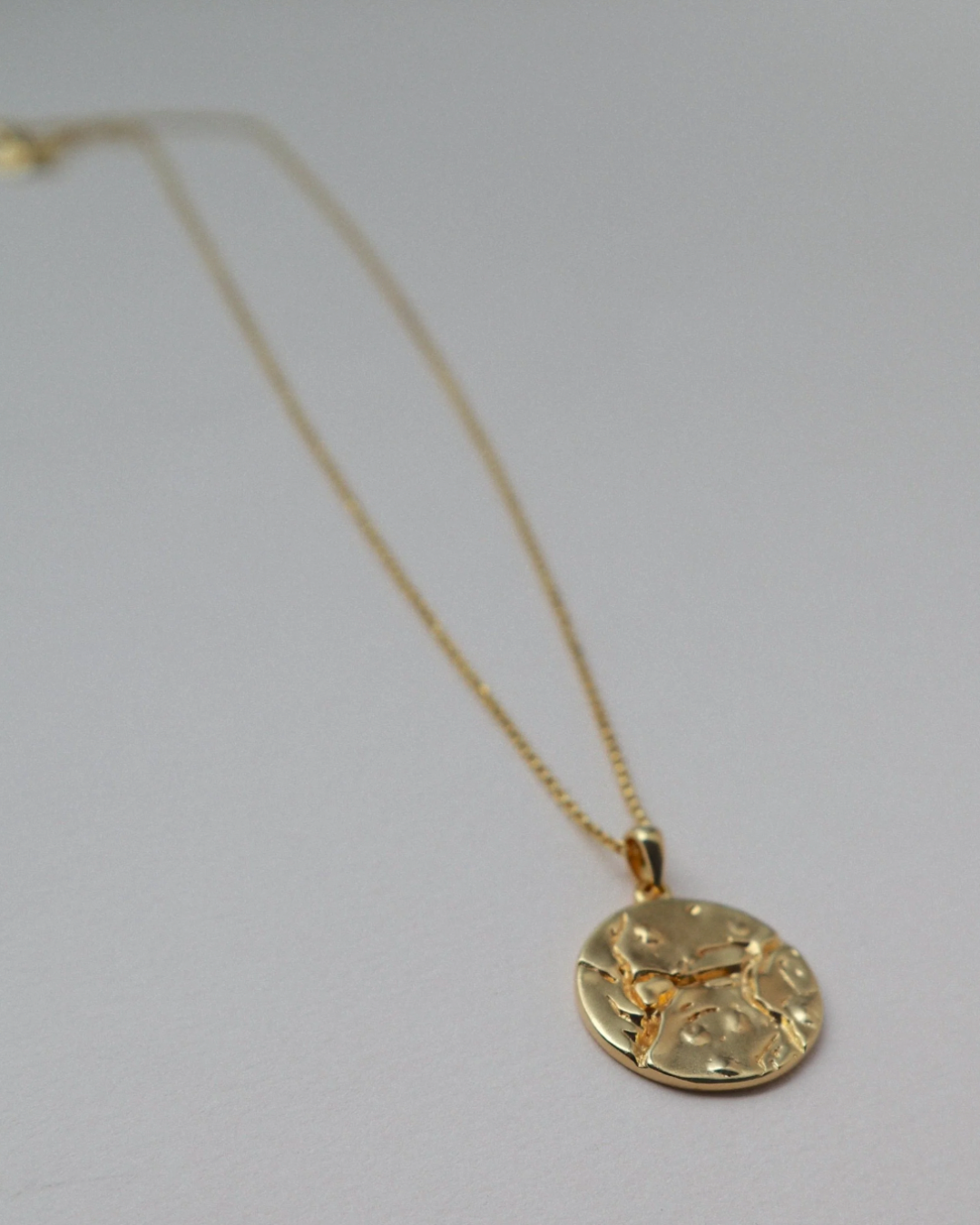cosmo gold necklace