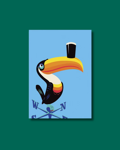 print of a toucan with a pint of Guinness on its beak, perched on a weathervane. Blue background