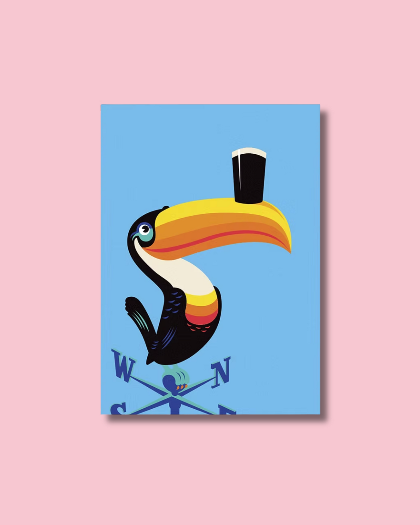 print of a toucan with a pint of Guinness on its beak, perched on a weathervane. Blue background