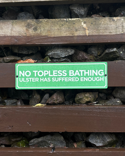 No Topless Bathing Sign