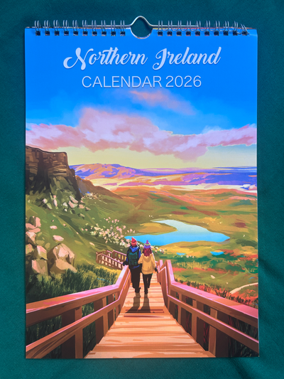Calendar cover for 2026 featuring a scenic view of Northern Ireland with two people on a wooden bridge.